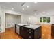 Open layout with kitchen island, showcasing stainless steel appliances and modern design at 273 12Th Ne St # 210, Atlanta, GA 30309
