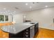 Kitchen island with sink, dishwasher, and ample counter space in an open layout at 273 12Th Ne St # 210, Atlanta, GA 30309