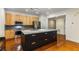 Contemporary kitchen with sleek island, stainless steel appliances, and light wood cabinets at 273 12Th Ne St # 210, Atlanta, GA 30309
