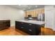 Spacious kitchen featuring a large island, stainless steel appliances, and light wood cabinets at 273 12Th Ne St # 210, Atlanta, GA 30309