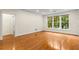 Bright living room featuring hardwood floors and large windows at 273 12Th Ne St # 210, Atlanta, GA 30309