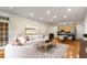 Open concept living and dining area with hardwood floors and a modern kitchen in the background at 273 12Th Ne St # 210, Atlanta, GA 30309