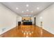 Open living space featuring hardwood floors and a modern kitchen in the background at 273 12Th Ne St # 210, Atlanta, GA 30309