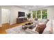 Bright living room featuring hardwood floors, lots of natural light, and contemporary furnishings at 273 12Th Ne St # 210, Atlanta, GA 30309