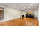 Spacious living area with hardwood floors and a modern kitchen in the background at 273 12Th Ne St # 210, Atlanta, GA 30309