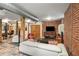 Contemporary living area boasts exposed brick, duct work, beams, and ample seating for comfortable everyday living at 273 12Th Ne St # 210, Atlanta, GA 30309
