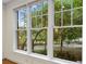 Large windows offering a view of mature trees and landscaping at 273 12Th Ne St # 210, Atlanta, GA 30309