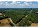 Aerial view of property with pond and road access at 4955 H D Atha Rd, Covington, GA 30014