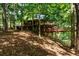House nestled in a wooded area, elevated position at 4955 H D Atha Rd, Covington, GA 30014