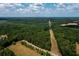 Aerial view of property showing large lot, pond, and surrounding trees at 4955 H D Atha Rd, Covington, GA 30014