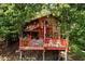 Lakefront home with large deck and surrounding trees at 4955 H D Atha Rd, Covington, GA 30014