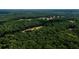 Aerial view of large lot in wooded area at 4955 H D Atha Rd, Covington, GA 30014