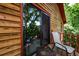 Inviting wood balcony with seating, offering a tranquil view and seamless indoor-outdoor living at 4955 H D Atha Rd, Covington, GA 30014