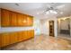 Spacious basement room with built-in cabinets and tile flooring at 4955 H D Atha Rd, Covington, GA 30014