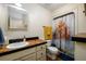 Bathroom with shower, toilet and updated vanity at 4955 H D Atha Rd, Covington, GA 30014