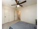 Bright bedroom with carpet, ceiling fan and access to hallway at 4955 H D Atha Rd, Covington, GA 30014