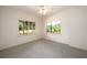 Bright bedroom with lake view and neutral carpeting at 4955 H D Atha Rd, Covington, GA 30014