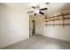 Bedroom with carpet, ceiling fan and built-in shelves at 4955 H D Atha Rd, Covington, GA 30014