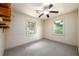 Well-lit bedroom with carpet and ceiling fan at 4955 H D Atha Rd, Covington, GA 30014