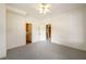 Simple bedroom with carpet flooring and access to other rooms at 4955 H D Atha Rd, Covington, GA 30014