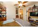 Cozy bedroom with built-in shelves and ceiling fan at 4955 H D Atha Rd, Covington, GA 30014