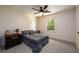 Spacious bedroom with gray carpeting and ceiling fan at 4955 H D Atha Rd, Covington, GA 30014