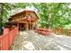 Large deck with picnic table, chairs, and lake views at 4955 H D Atha Rd, Covington, GA 30014