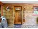 Wooden front door with glass accents and welcome sign at 4955 H D Atha Rd, Covington, GA 30014