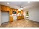 Basement kitchen with tile floor and wood cabinets at 4955 H D Atha Rd, Covington, GA 30014