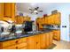 Kitchen features a large island, granite countertops, and wood cabinets at 4955 H D Atha Rd, Covington, GA 30014