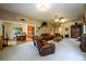 Spacious living room featuring leather recliners, a wood-burning stove, and an open floor plan at 4955 H D Atha Rd, Covington, GA 30014