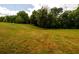 Large grassy yard with mature trees at 4955 H D Atha Rd, Covington, GA 30014