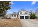 Charming two-story home with a well-manicured lawn, a spacious driveway, and a two-car garage at 556 Rivercrest Dr, Woodstock, GA 30188