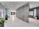 Building hallway with modern wood wall and tile floors at 923 Peachtree Ne St # 1624, Atlanta, GA 30309