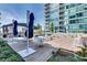 Expansive rooftop deck with multiple seating areas, umbrellas, and city views at 923 Peachtree Ne St # 1624, Atlanta, GA 30309