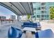 Upscale rooftop terrace with comfortable seating, a pergola, and city views at 923 Peachtree Ne St # 1624, Atlanta, GA 30309