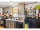 Bright kitchen featuring wood cabinets, appliances, and double sink at 127 Cambridge Ct, Hampton, GA 30228