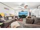 Comfortable living room with gray sectional sofa and large TV at 127 Cambridge Ct, Hampton, GA 30228