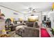 Living room featuring gray sectional sofa and large TV at 127 Cambridge Ct, Hampton, GA 30228