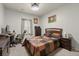 Cozy bedroom with a double bed, dresser, and workspace at 213 Janney Cir, Mcdonough, GA 30253