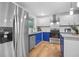 Modern kitchen with stainless steel appliances and blue cabinets at 2522 Candler Woods Dr, Decatur, GA 30032