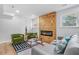 Living room with wood-look floors, fireplace, and modern furniture at 2522 Candler Woods Dr, Decatur, GA 30032