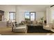 A bright, open living room featuring hardwood floors, neutral tones, and large windows with great natural light at 318 Sandy Springs Cir # 250, Sandy Springs, GA 30328