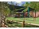 A Gathering-friendly playground with climbing structures, swings, and slides at 318 Sandy Springs Cir # 250, Sandy Springs, GA 30328