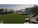 Expansive rooftop lawn is complemented by lounge chairs and an outdoor kitchen perfect for entertaining and relaxation at 318 Sandy Springs Cir # 250, Sandy Springs, GA 30328