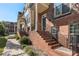 Brick townhouse exterior with a front porch and walkway at 3587 Adelaide Xing, Brookhaven, GA 30319