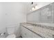 Bathroom with granite countertop, vanity, and updated fixtures at 1230 Piedmont Ne Ave # 405, Atlanta, GA 30309
