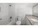 Clean bathroom with white subway tile, granite vanity, and tub at 1230 Piedmont Ne Ave # 405, Atlanta, GA 30309