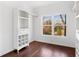 Bright bedroom closet with built-in shelving and hanging rod at 1230 Piedmont Ne Ave # 405, Atlanta, GA 30309