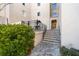 Building exterior with stone steps and patio seating area at 1230 Piedmont Ne Ave # 405, Atlanta, GA 30309